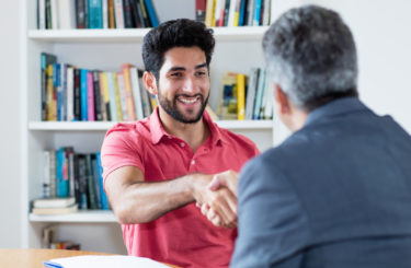 Handshake of latin american male apprentice after job interview