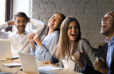 African American businessman with employees celebrating business success, achievement, company staff excited by victory, colleagues cheering winning black worker, received promotion, great work result