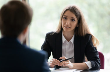 HR manager interviewing male applicant answers questions pass job interview