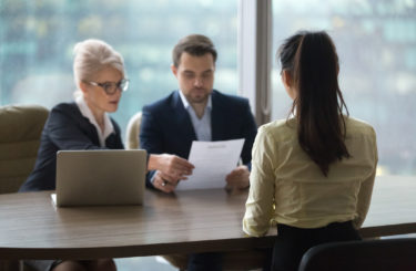 Female candidate interview with HR managers in office