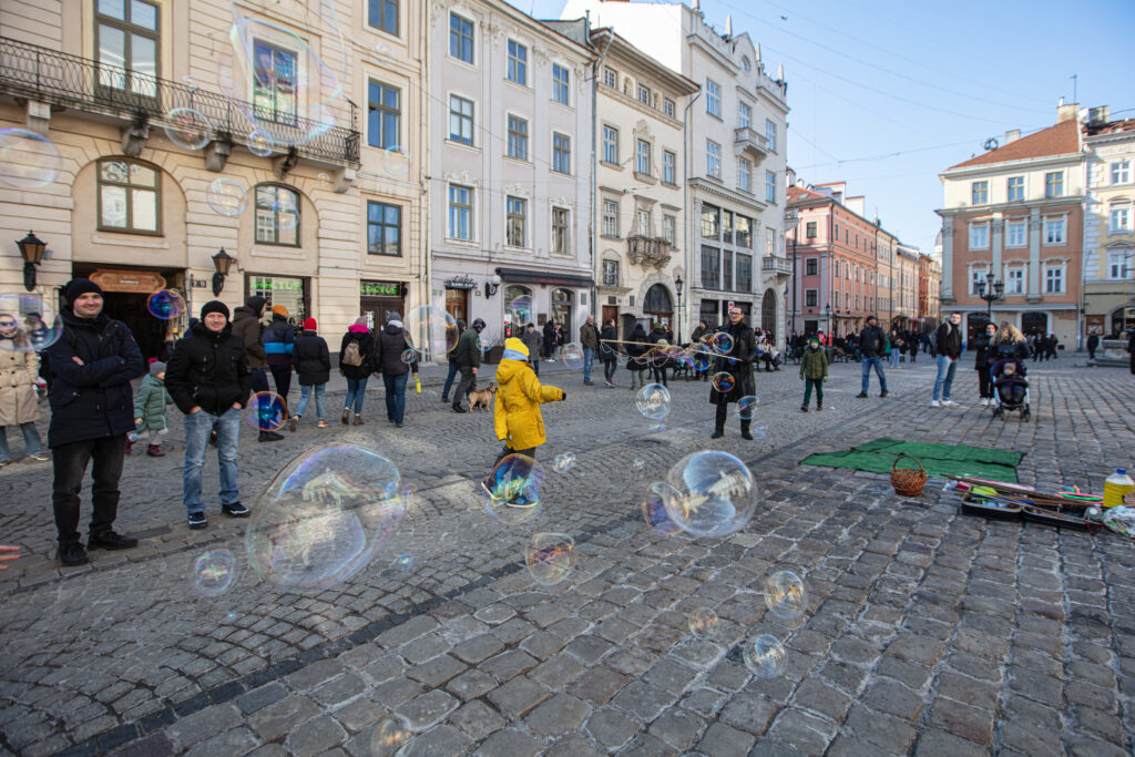 Lviv, Ukraine - March 13, 2022: Evetyday live in Lviv during russian war. Refugees, children on streets